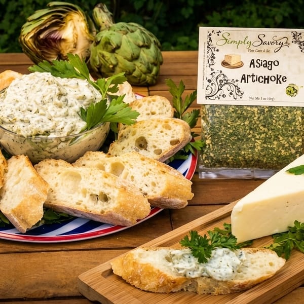 Asiago Artichoke dip with sliced baguette, a wedge of cheese, and a seasoning packet.